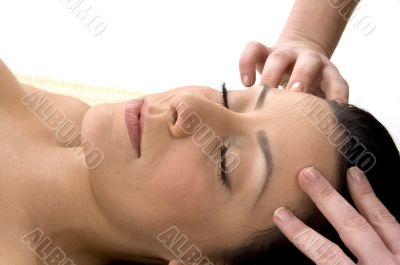 front view of female taking head massage