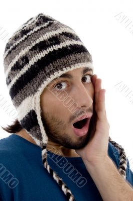 shocked young man wearing winter hat