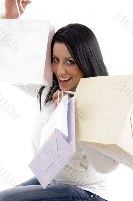 pleased woman posing with shopping bags