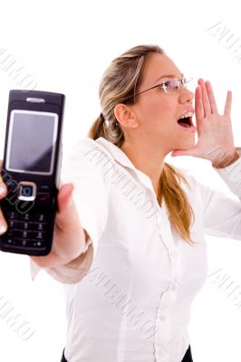 portrait of shouting manager showing cell phone