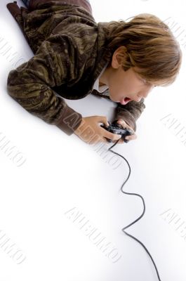 high angle view of amazed boy playing videogame
