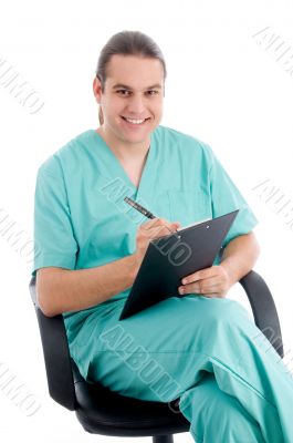 male surgeon writing prescription