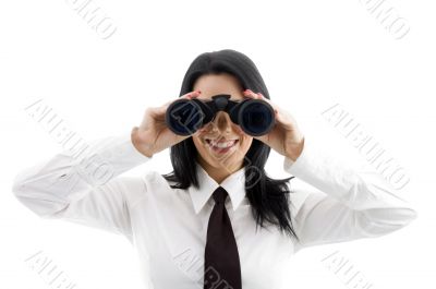 young businesswoman looking through binocular
