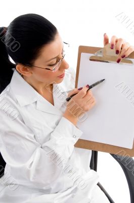 female doctor indicating writing pad
