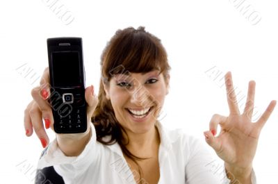 smiling female executive holding mobile