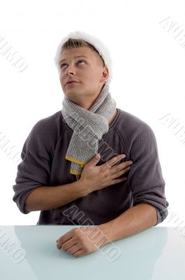 man with christmas hat putting hand on his chest
