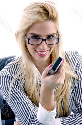 front view of smiling female showing mobile