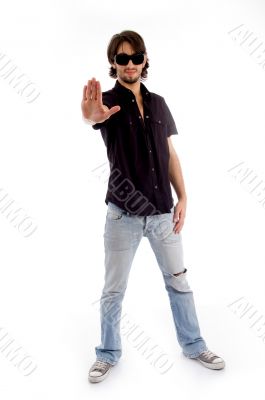 standing male showing stopping hand gesture
