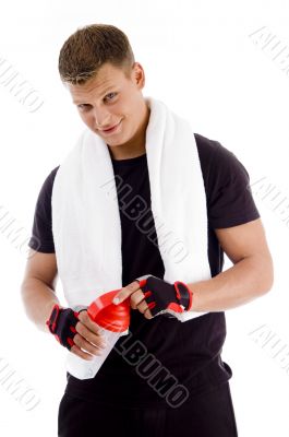 muscular male opening the cap of water bottle