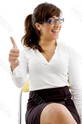front view of smiling female with thumbs up