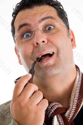 man holding tobacco pipe giving amazed expression