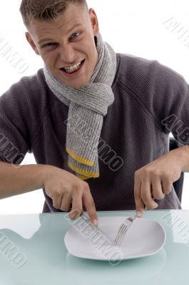 male posing with fork and knife