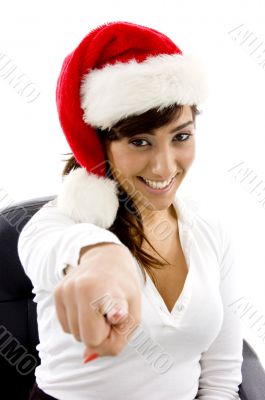 smiling attorney in christmas hat pointing at came