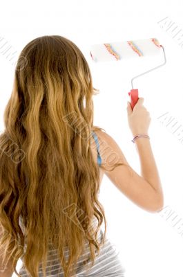 back pose of girl with roller paint brush back pose of girl with roller paint brush