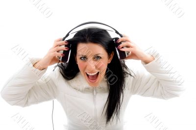 portrait of shouting woman enjoying music