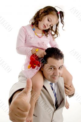 girl sitting on her father`s shoulders and father