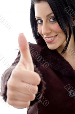 female with thumbs up on white background