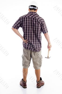 back pose of worker holding hammer