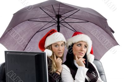 young executives posing together in christmas hat