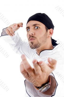 angered male chef posing with karate