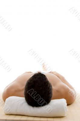front view of man lying down for spa treatment