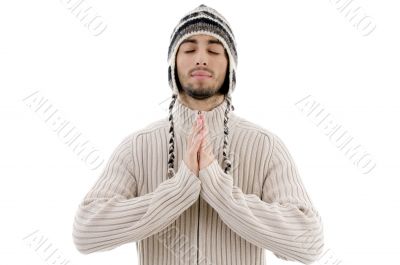 young guy praying with joined hands