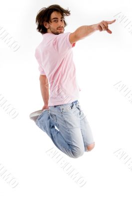fashionable guy jumping high in the mid air