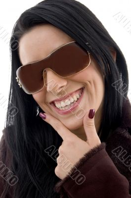 pleased female wearing sunglasses on white backgro