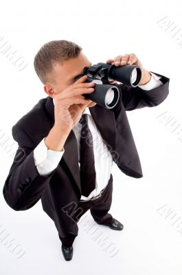 young accountant looking through binoculars