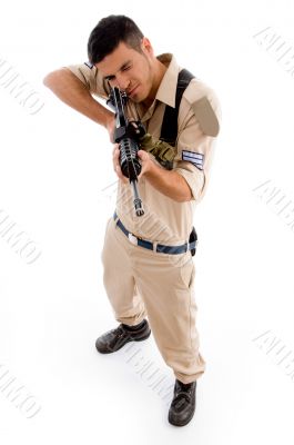 standing soldier pointing with gun