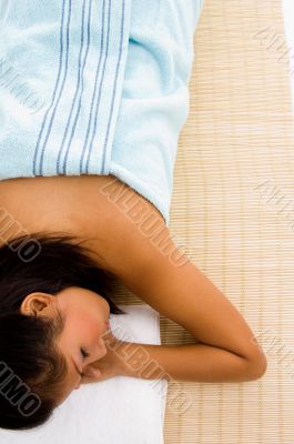 resting beautiful adult female in towel