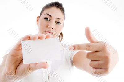 attractive model pointing towards business card