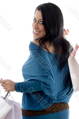 back pose of smiling model with carry bags