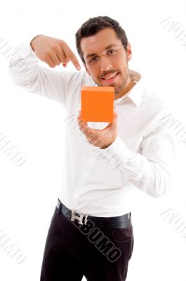 young man indicating towards jewellery box