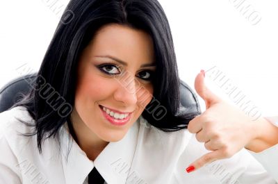 female showing telephonic hand gesture