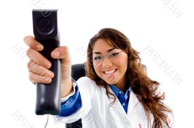 smiling doctor showing phone receiver