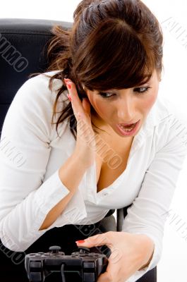 front view of shocked woman with remote