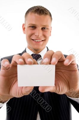 smiling executive holding business card