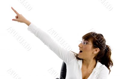 surprised female executive pointing sideways