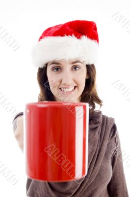 female in christmas hat showing her coffee mug