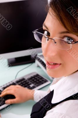 side view of corporate woman looking at camera