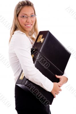 side view of smiling employee holding briefcase