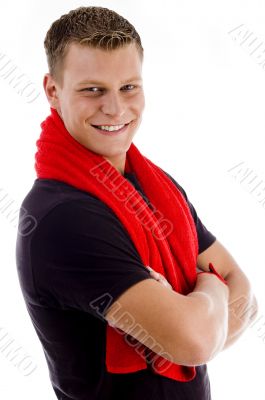 smiling muscular man with towel and crossed arms