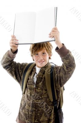 school boy at camera showing copy space