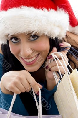 woman with christmas hat and shopping bags woman with christmas hat and shopping bags