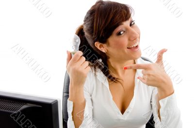 portrait of smiling woman indicating receiver portrait of smiling woman indicating receiver
