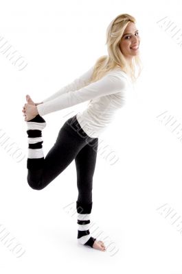 side view of woman stretching her back side view of woman stretching her back