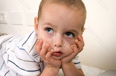 child in thinking pose
