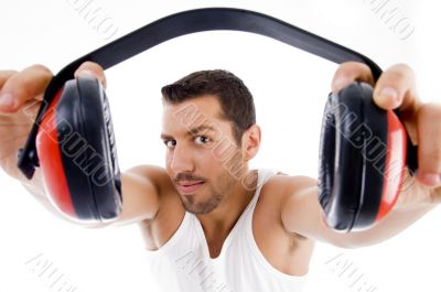 handsome male showing headphone handsome male showing headphone