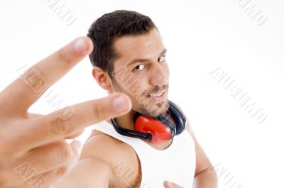 male showing victory sign male showing victory sign